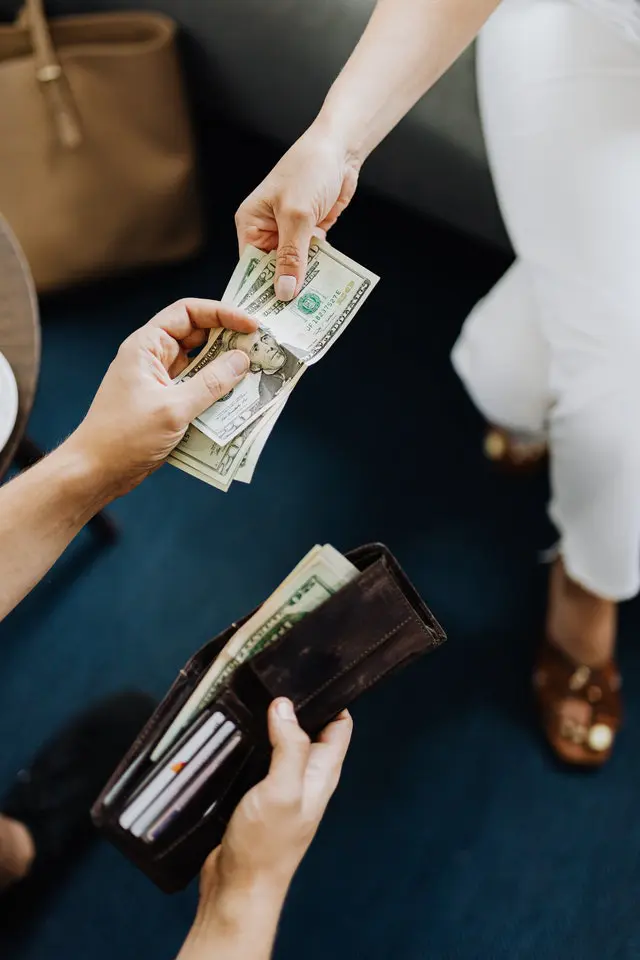 Man and Woman Exchanging Money